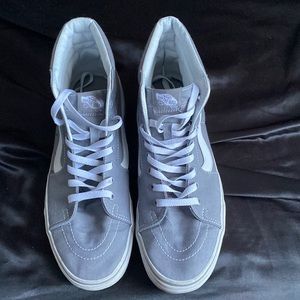 Grey and white high top vans